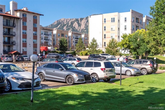 2850 Aurora Ave Unit 112, Boulder, CO 80303 - uncovered parking lot featuring a mountain view