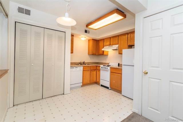 2850 Aurora Ave Unit 112, Boulder, CO 80303 - kitchen featuring white appliances, under cabinet range hood, a sink, light floors, and light countertops