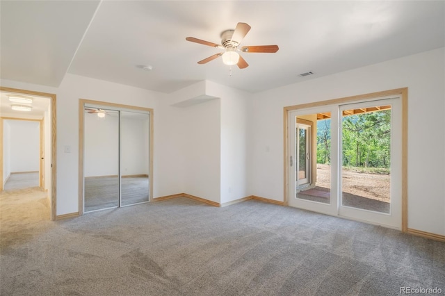 unfurnished bedroom with light carpet, ceiling fan, a closet, and access to outside