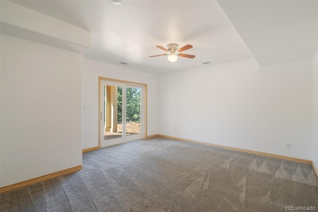 carpeted empty room featuring ceiling fan