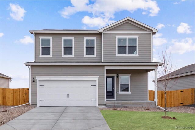 view of property with a garage and a front yard