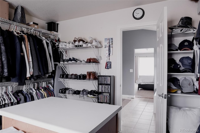 spacious closet with light tile patterned floors