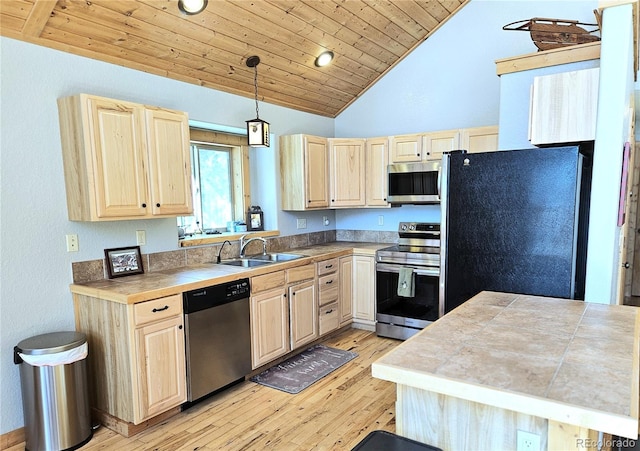 kitchen with stainless steel appliances, wooden ceiling, light brown cabinets, and a sink