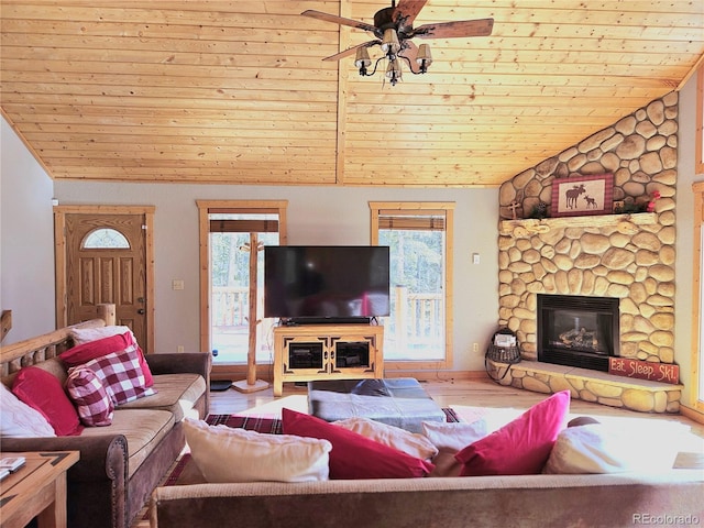 living area with lofted ceiling, ceiling fan, wooden ceiling, a fireplace, and wood finished floors