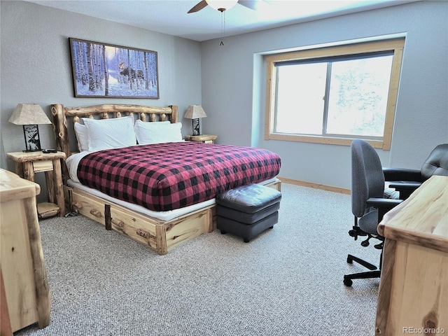 carpeted bedroom with baseboards and a ceiling fan