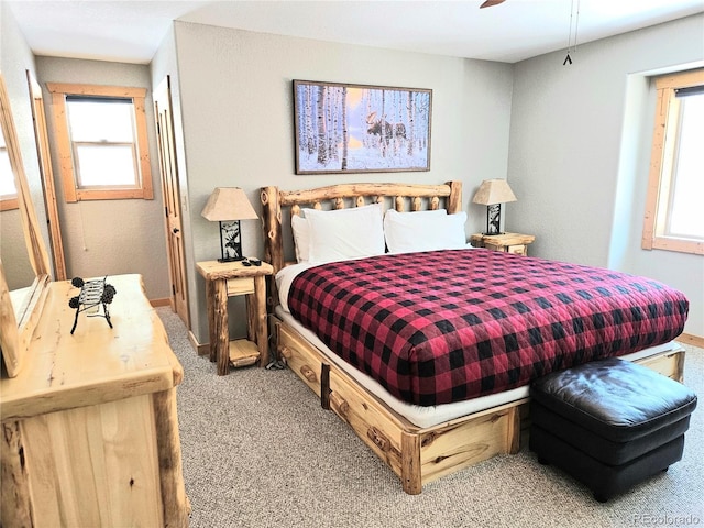 bedroom featuring baseboards and carpet flooring