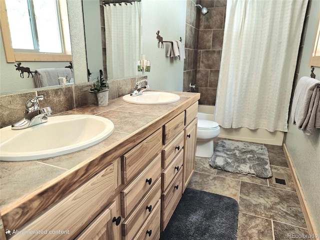 full bathroom featuring shower / bath combo, a sink, toilet, and double vanity