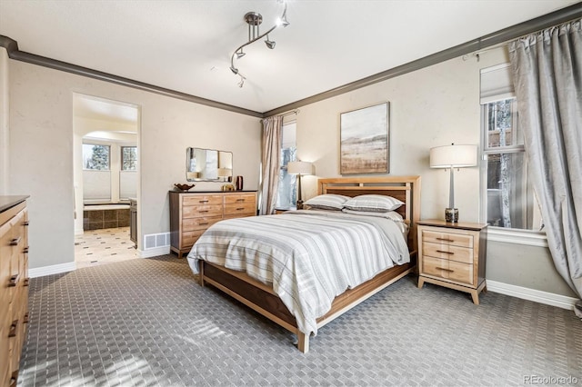 carpeted bedroom with arched walkways, ornamental molding, visible vents, and baseboards