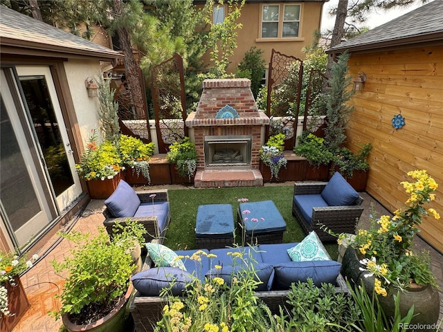 balcony with a patio area and an outdoor living space with a fireplace