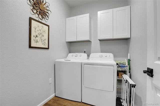 4040 Eaton Park St, Aurora, CO 80019 - laundry room featuring cabinet space, washer and dryer, wood finished floors, and baseboards