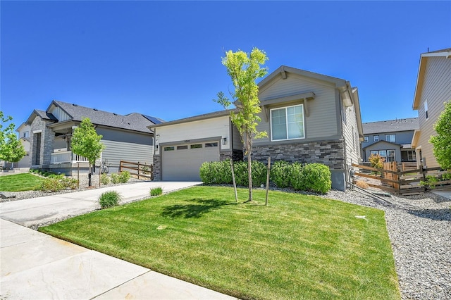 4040 Eaton Park St, Aurora, CO 80019 - view of front of home featuring stone siding, driveway, and an attached garage