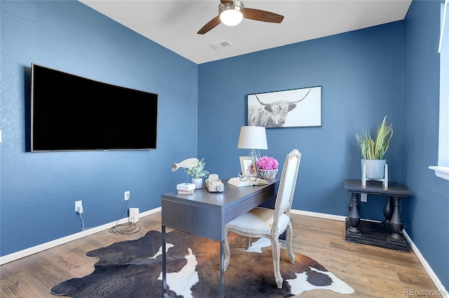 4040 Eaton Park St, Aurora, CO 80019 - home office with wood finished floors, a ceiling fan, and baseboards