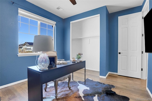4040 Eaton Park St, Aurora, CO 80019 - office space featuring wood finished floors, baseboards, and a ceiling fan