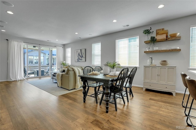 4040 Eaton Park St, Aurora, CO 80019 - dining area with healthy amount of natural light, light wood-style floors, recessed lighting, and baseboards