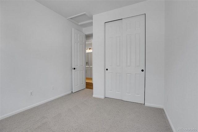 4040 Eaton Park St, Aurora, CO 80019 - unfurnished bedroom with attic access, light colored carpet, baseboards, and a closet