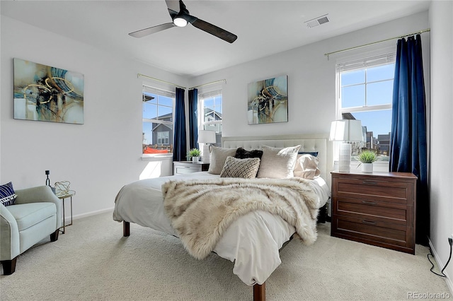 4040 Eaton Park St, Aurora, CO 80019 - carpeted bedroom with multiple windows, a ceiling fan, and baseboards