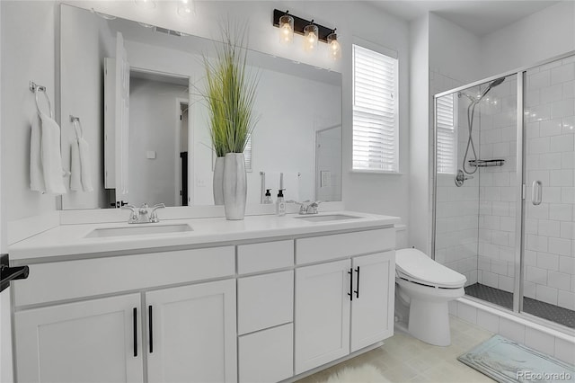 4040 Eaton Park St, Aurora, CO 80019 - full bath featuring a stall shower, toilet, and double vanity