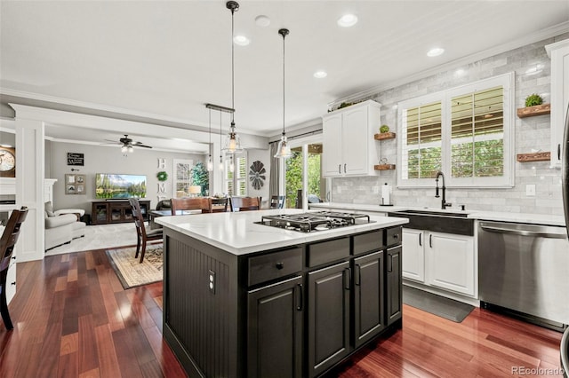 3188 Lynwood Ave, Highlands Ranch, CO 80126 - kitchen featuring white cabinets, crown molding, open shelves, a sink, and stainless steel appliances