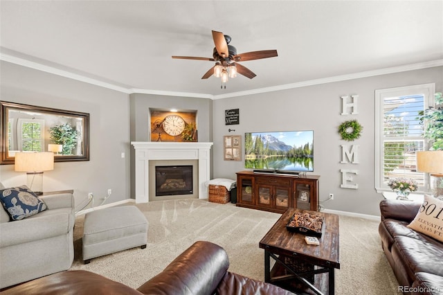 3188 Lynwood Ave, Highlands Ranch, CO 80126 - carpeted living area featuring baseboards, a glass covered fireplace, ornamental molding, and ceiling fan