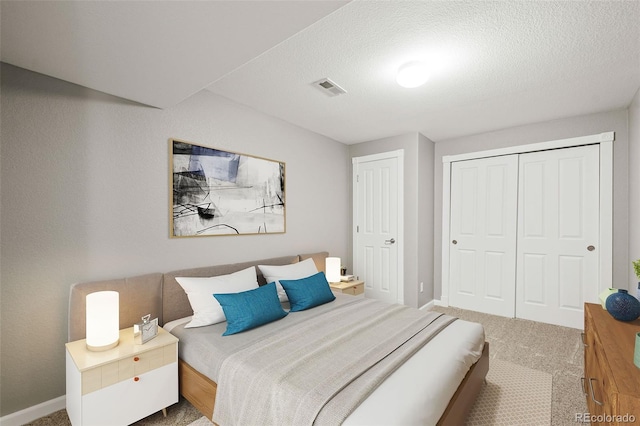 3188 Lynwood Ave, Highlands Ranch, CO 80126 - carpeted bedroom featuring visible vents, a textured ceiling, baseboards, and a closet