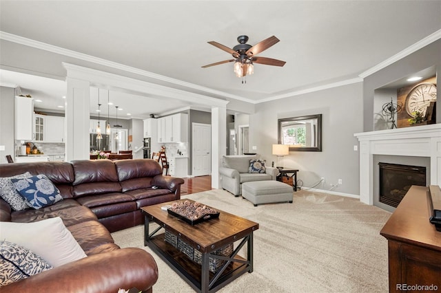 3188 Lynwood Ave, Highlands Ranch, CO 80126 - living room featuring crown molding, a ceiling fan, baseboards, and a glass covered fireplace