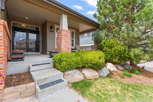 3188 Lynwood Ave, Highlands Ranch, CO 80126 - view of exterior entry featuring a porch and brick siding