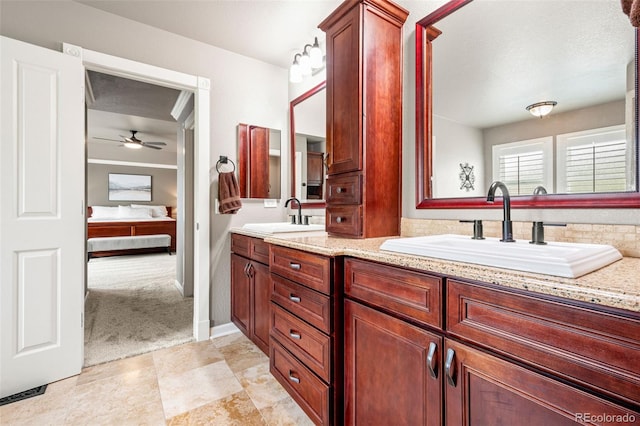 3188 Lynwood Ave, Highlands Ranch, CO 80126 - bathroom featuring a sink, a ceiling fan, double vanity, and connected bathroom