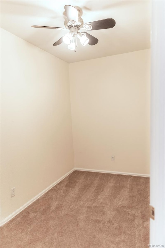 empty room featuring light carpet and ceiling fan