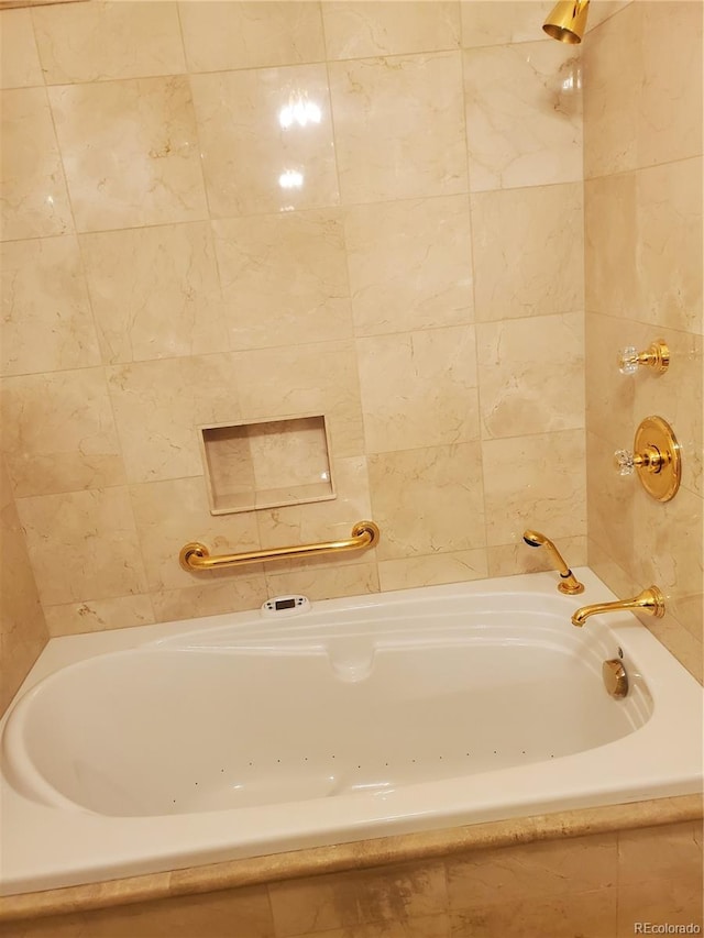 bathroom featuring tiled bath