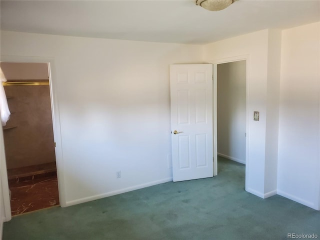 unfurnished bedroom featuring dark colored carpet