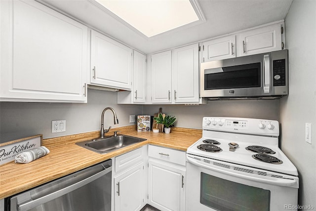 kitchen featuring sink, white cabinets, and stainless steel appliances