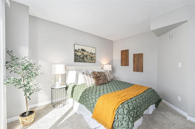 carpeted bedroom with a textured ceiling