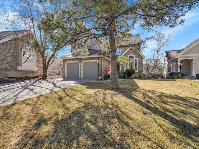 8312 S Peninsula Dr, Littleton, CO 80120 - view of front of house featuring driveway, a garage, a front lawn, and stone siding