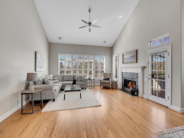 8312 S Peninsula Dr, Littleton, CO 80120 - living room with a ceiling fan, high vaulted ceiling, baseboards, a fireplace, and wood finished floors