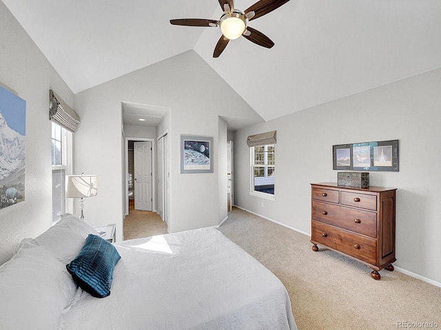 8312 S Peninsula Dr, Littleton, CO 80120 - bedroom featuring light carpet, multiple windows, vaulted ceiling, a ceiling fan, and baseboards