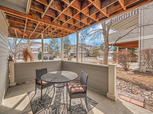 8312 S Peninsula Dr, Littleton, CO 80120 - view of patio / terrace with outdoor dining space and a residential view