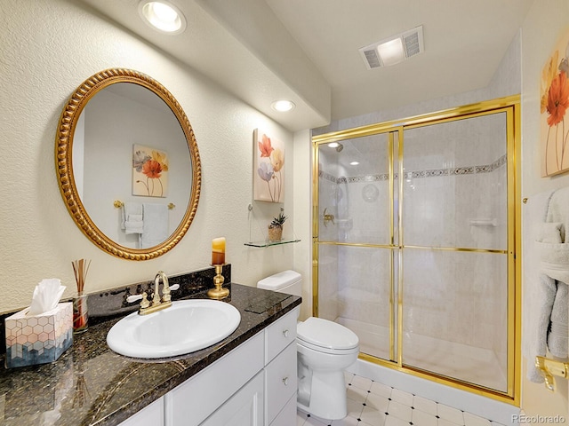 8312 S Peninsula Dr, Littleton, CO 80120 - full bathroom with a shower stall, toilet, vanity, and tile patterned floors