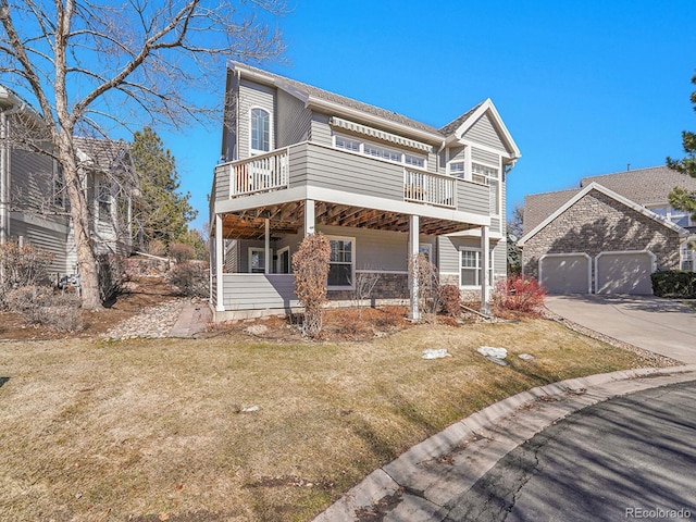 8312 S Peninsula Dr, Littleton, CO 80120 - view of front facade with driveway, a front yard, and a garage