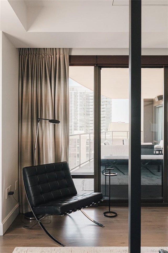 living area with hardwood / wood-style floors