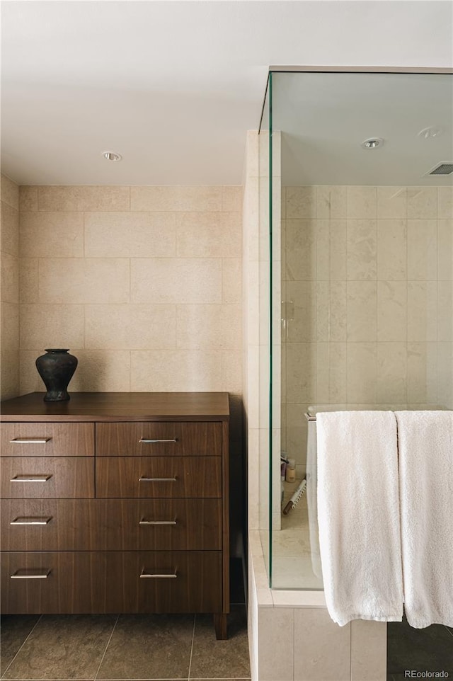 bathroom featuring tile walls and tile patterned flooring