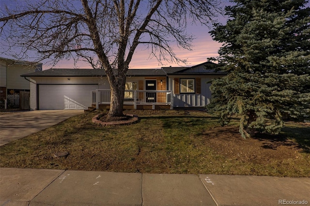 view of front of property with covered porch and a garage