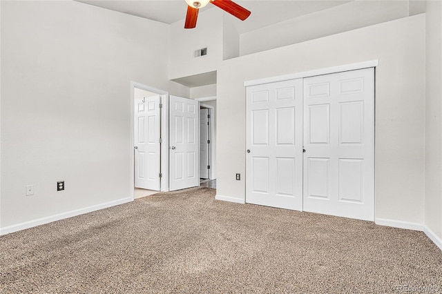 3261 S Waco Ct Unit C, Aurora, CO 80013 - unfurnished bedroom with carpet, baseboards, a closet, and a high ceiling