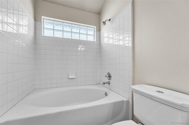 3261 S Waco Ct Unit C, Aurora, CO 80013 - full bath featuring toilet, a textured wall, and bathtub / shower combination
