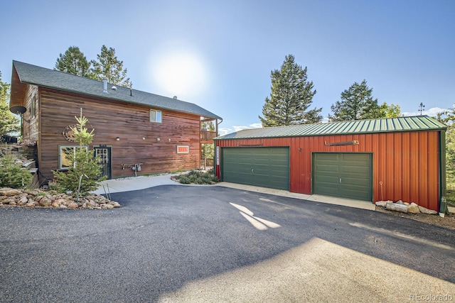 garage featuring wood walls