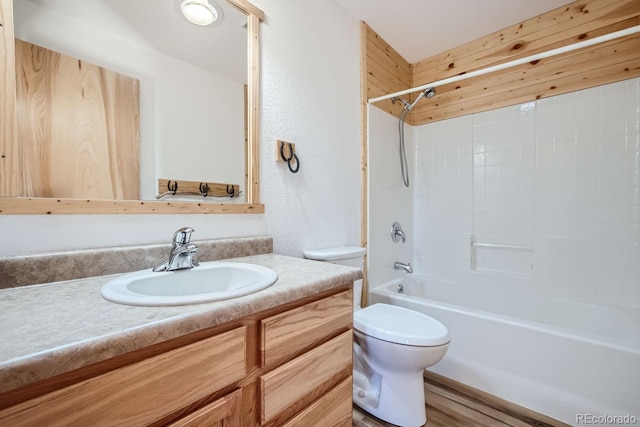 full bathroom featuring vanity, toilet, shower / bathing tub combination, and hardwood / wood-style flooring