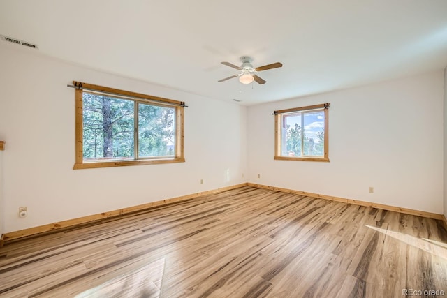 unfurnished room with light hardwood / wood-style flooring and ceiling fan