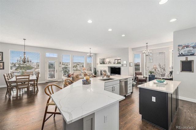 kitchen with decorative light fixtures, a center island, and a chandelier