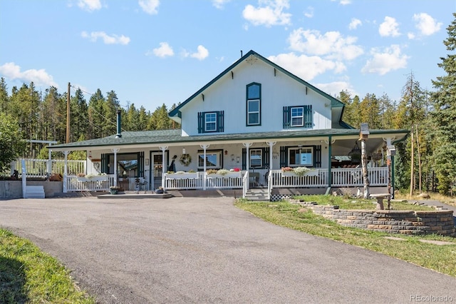 farmhouse inspired home with covered porch