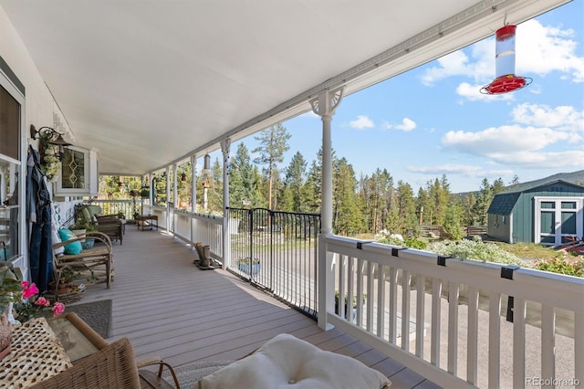 wooden deck featuring a storage shed