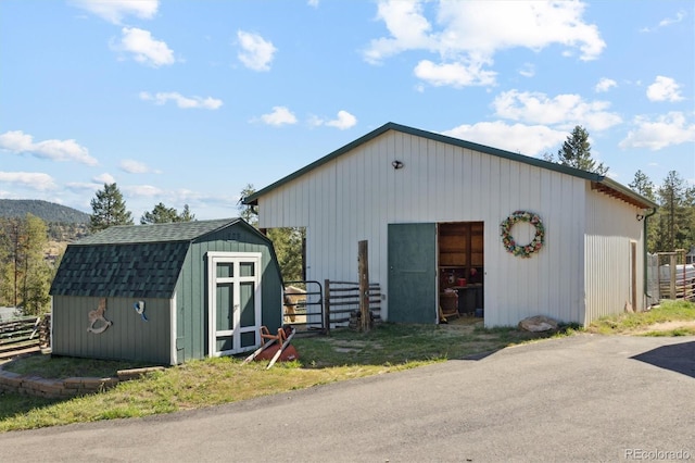 view of outbuilding with a mountain view